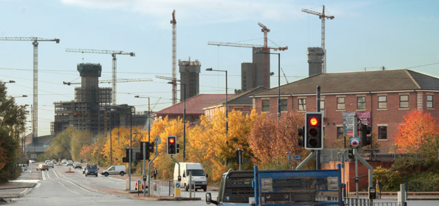 Quays Reach foreground right, with MediaCity (Salford) in the background